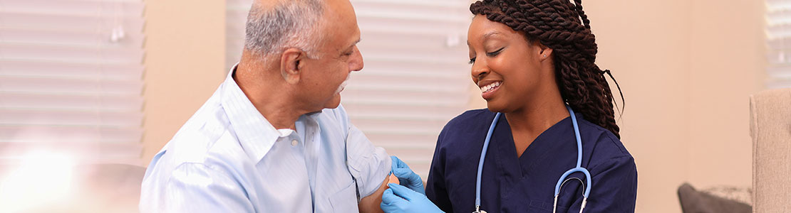 nurse giving a patient a vaccine